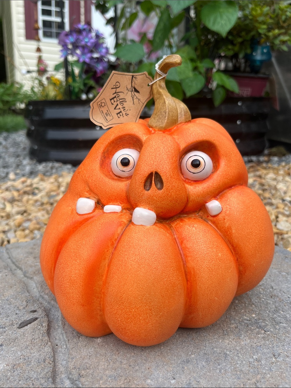Playful Orange Pumpkin Figurine with Curled Stem by
